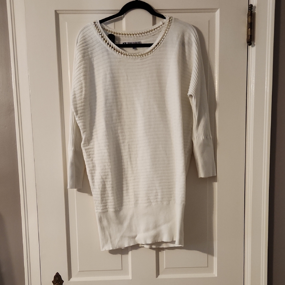 Jennifer Lopez Ivory Top with Gold Chain Detail